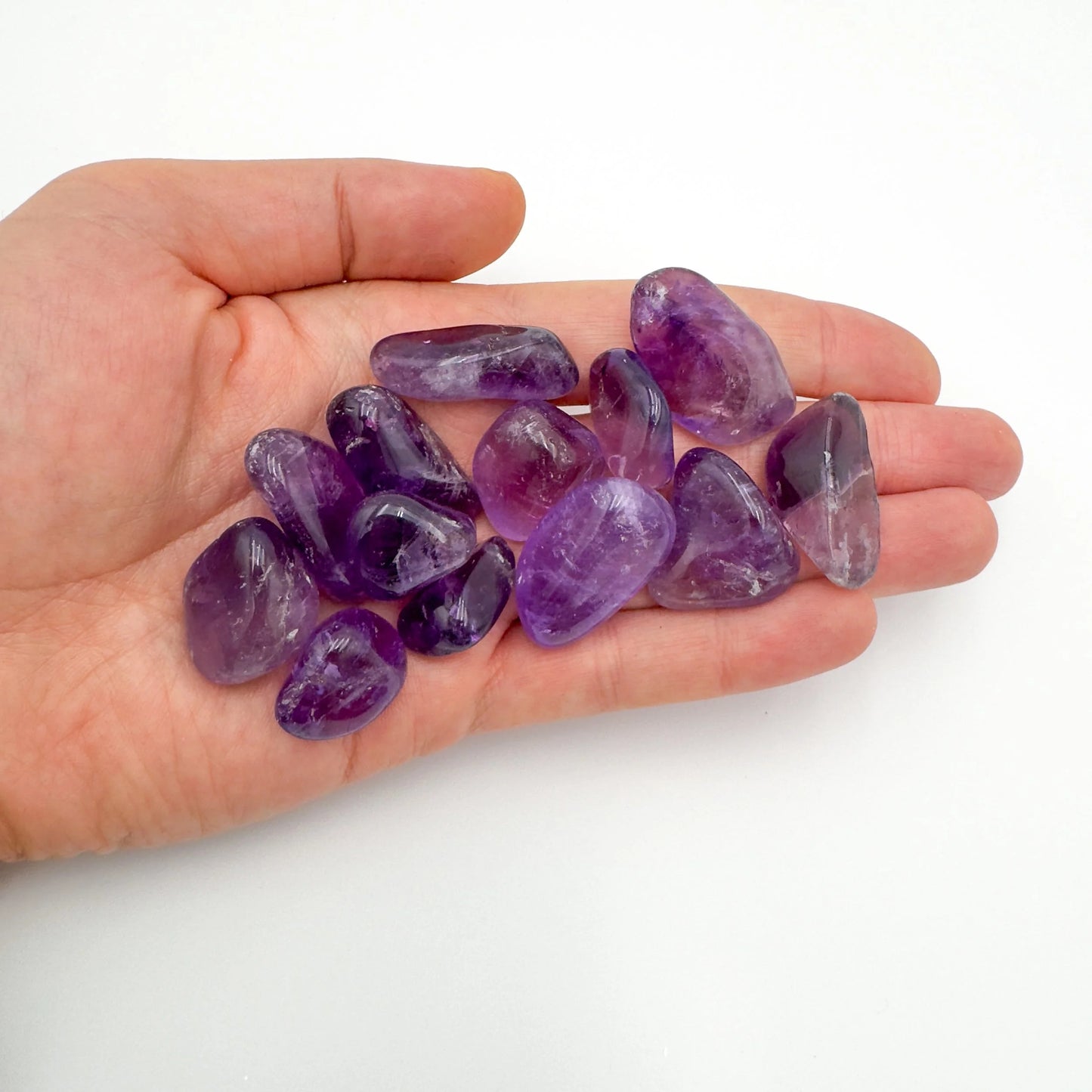 Back view of Grade AAA Amethyst tumbled stone showing natural surface