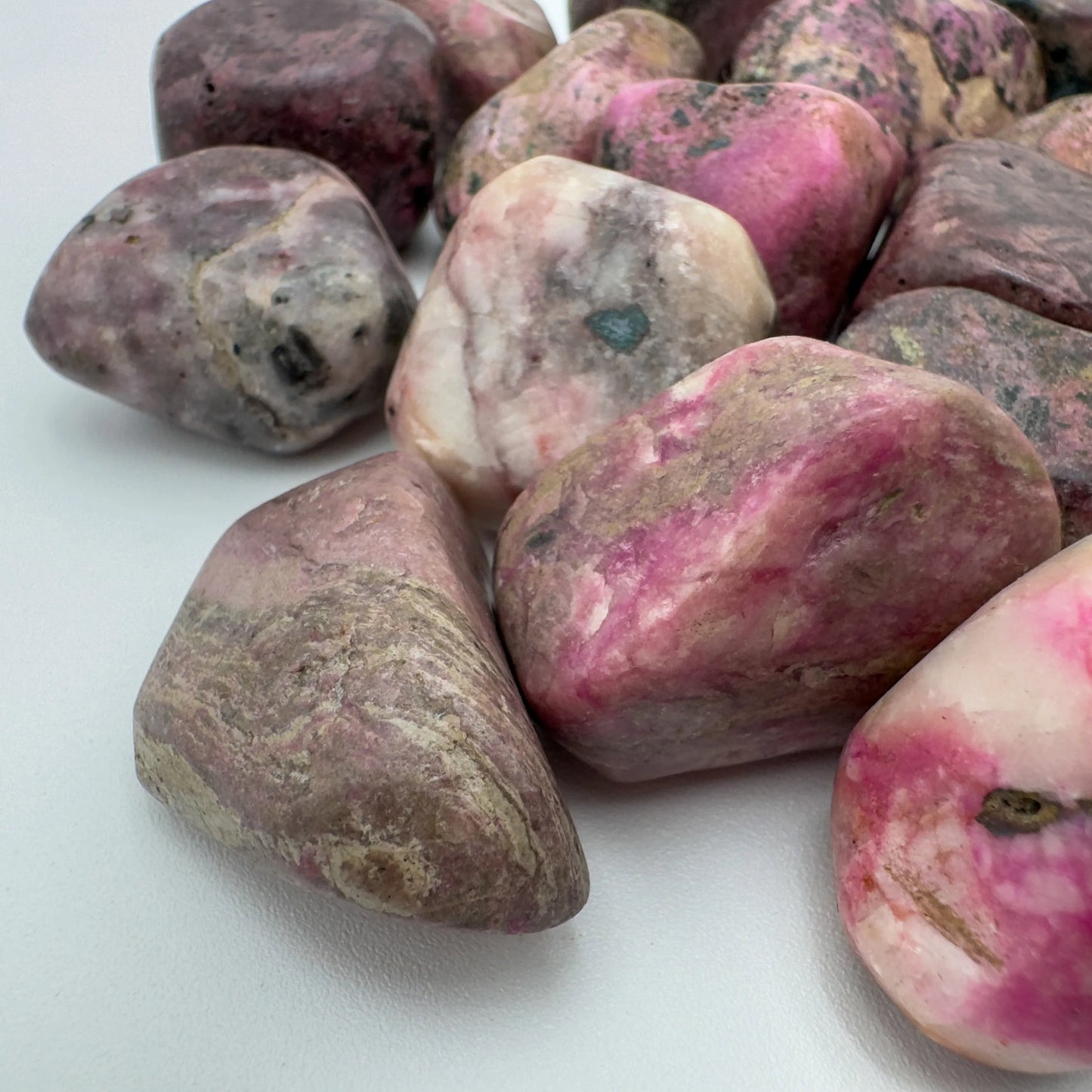 Color detail of Cobalt Calcite tumbled stone, showing natural variation, sourced from Democratic Republic of the Congo.