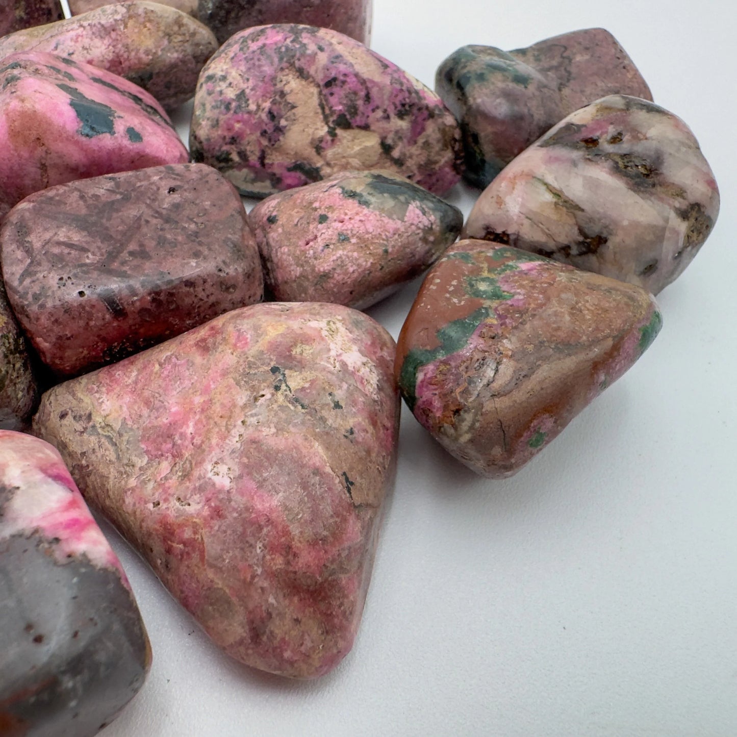 Profile shot of Cobalt Calcite tumbled stone, showing characteristic finish.