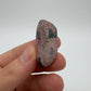 Detail shot of Grade A Cobalt Calcite tumbled stone under natural light