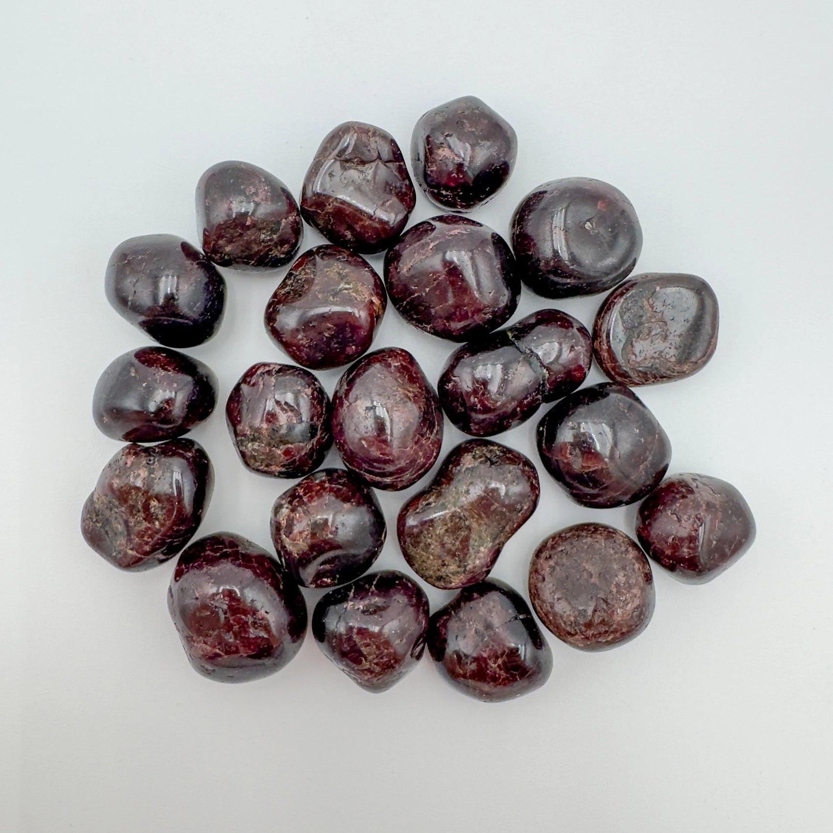 Garnet tumbled stone in Red tones, ethically sourced from Brazil for Confidence and Love