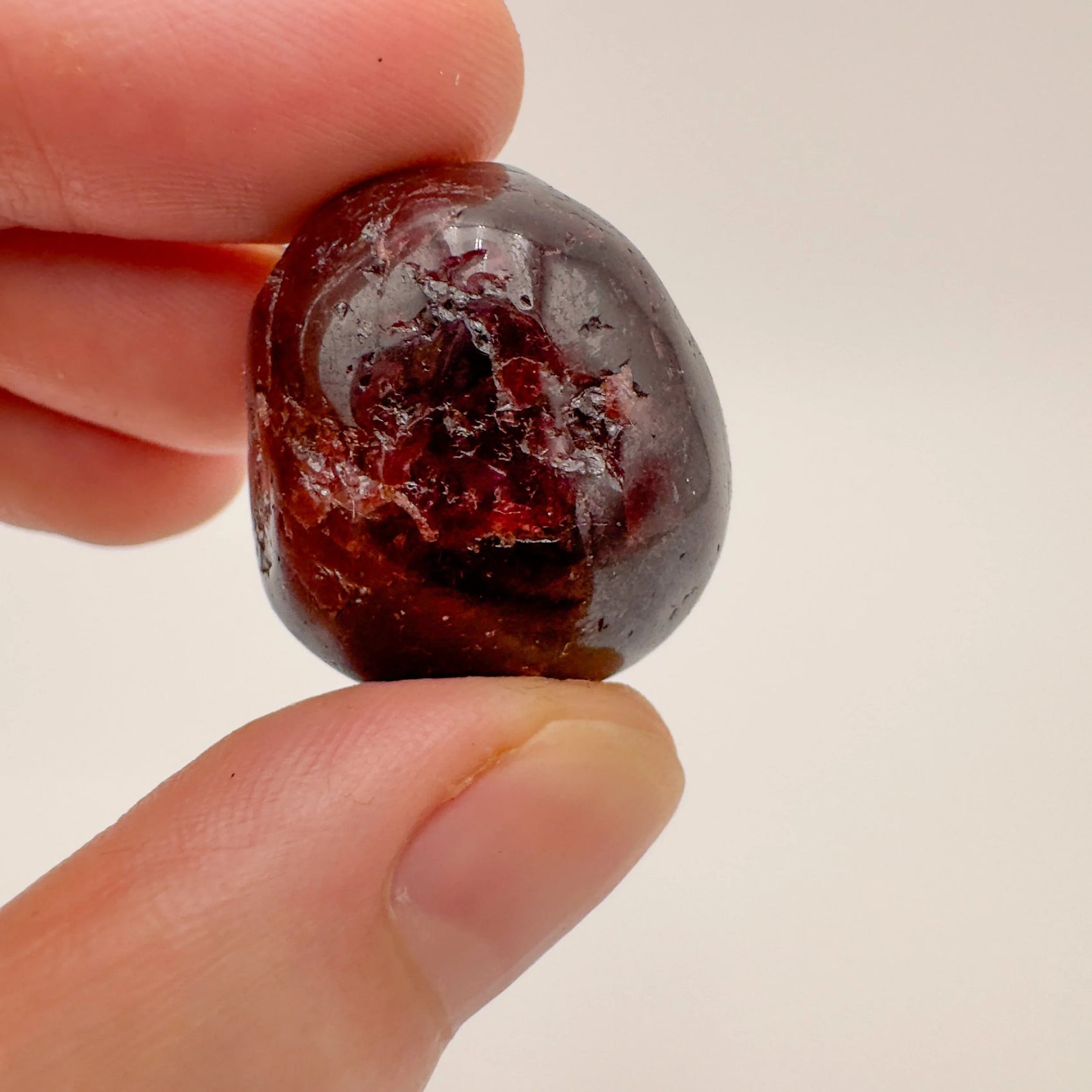 Garnet tumbled stone from Brazil with Red color, polished finish for mindful calm