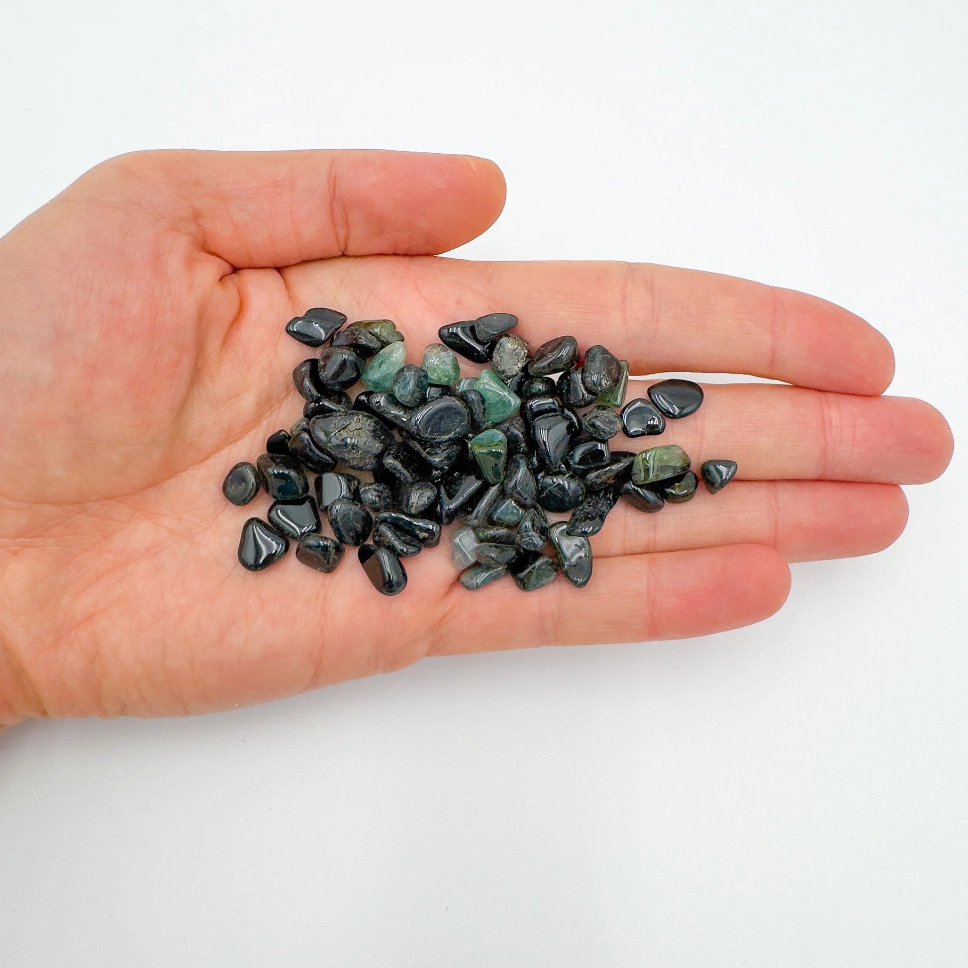 Alternate angle of Green Tourmaline polished chip, showing characteristic color.