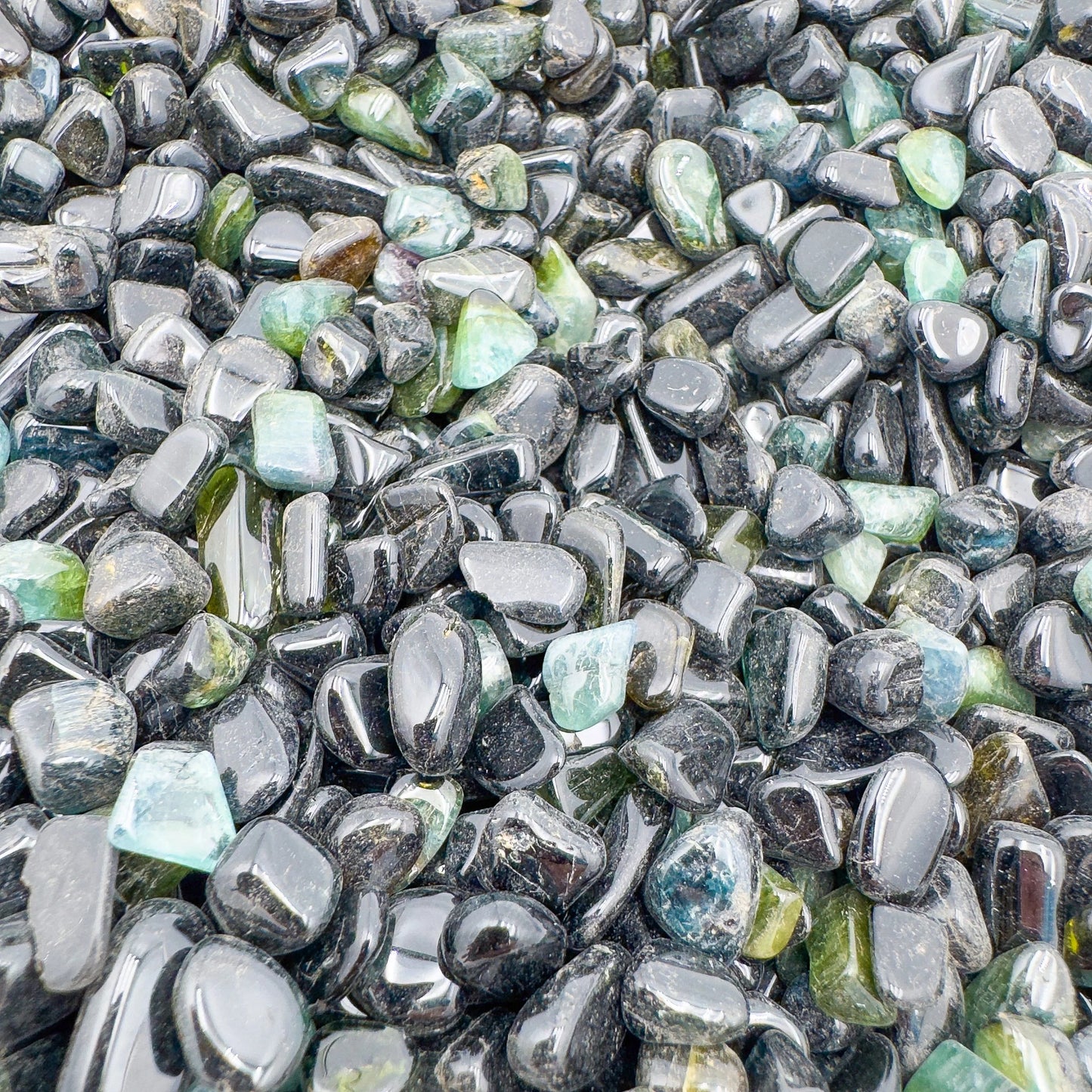 Bird's-eye view of Green Tourmaline polished chip, showing characteristic color, from Mozambique.