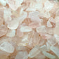Lateral view of Rose Quartz polished chip, South Africa-sourced, showing subtle veining.