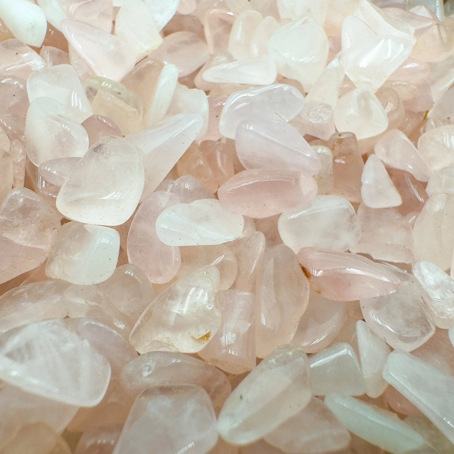 Lateral view of Rose Quartz polished chip, South Africa-sourced, showing subtle veining.
