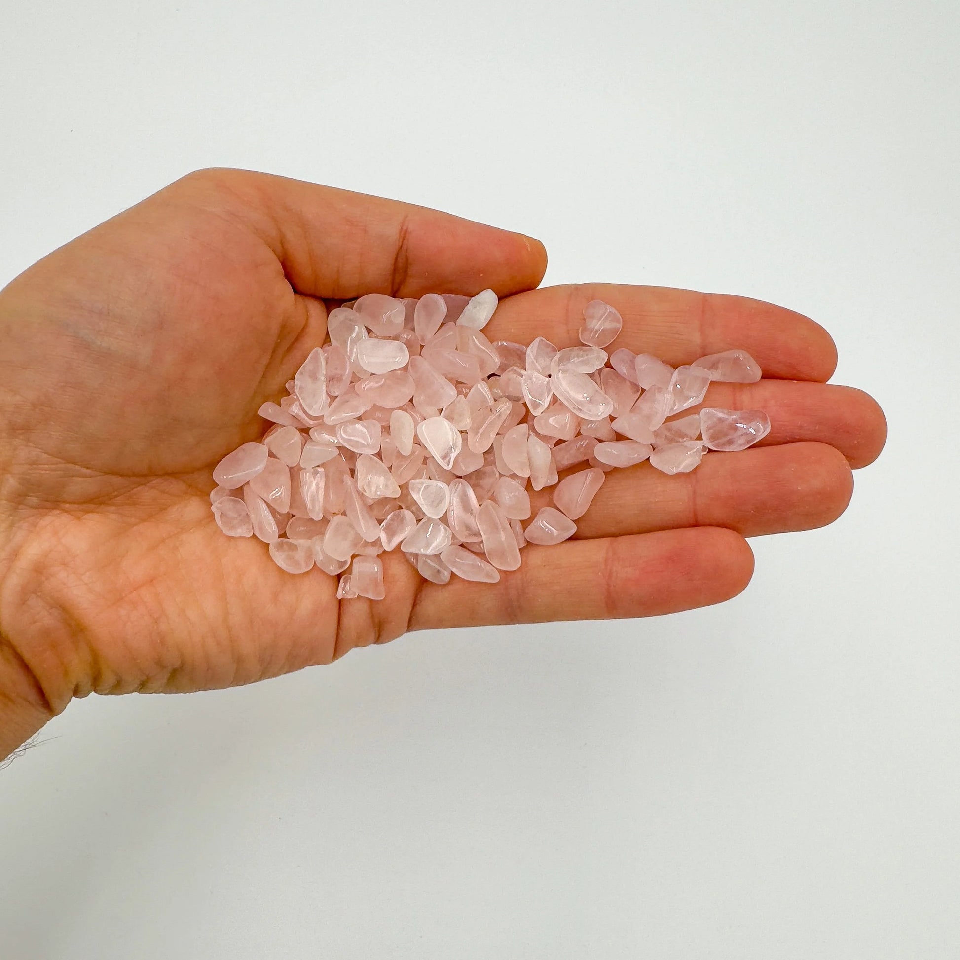 Reverse angle of Rose Quartz polished chip, traditionally used for Love, sourced from Northern Cape, South Africa.