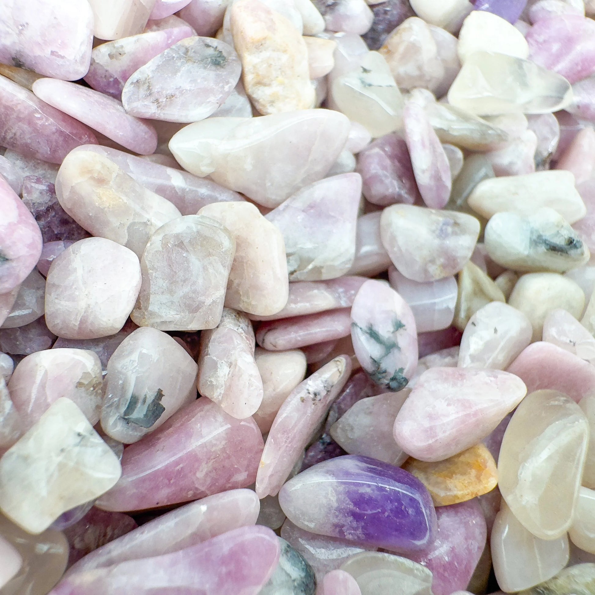 Overhead angle of Lepidolite polished chip, carried for Stress Relief and Emotional Healing, showing natural texture.