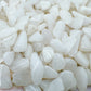 Up-close view of Grade A Snow Quartz polished chip, showing glassy finish.