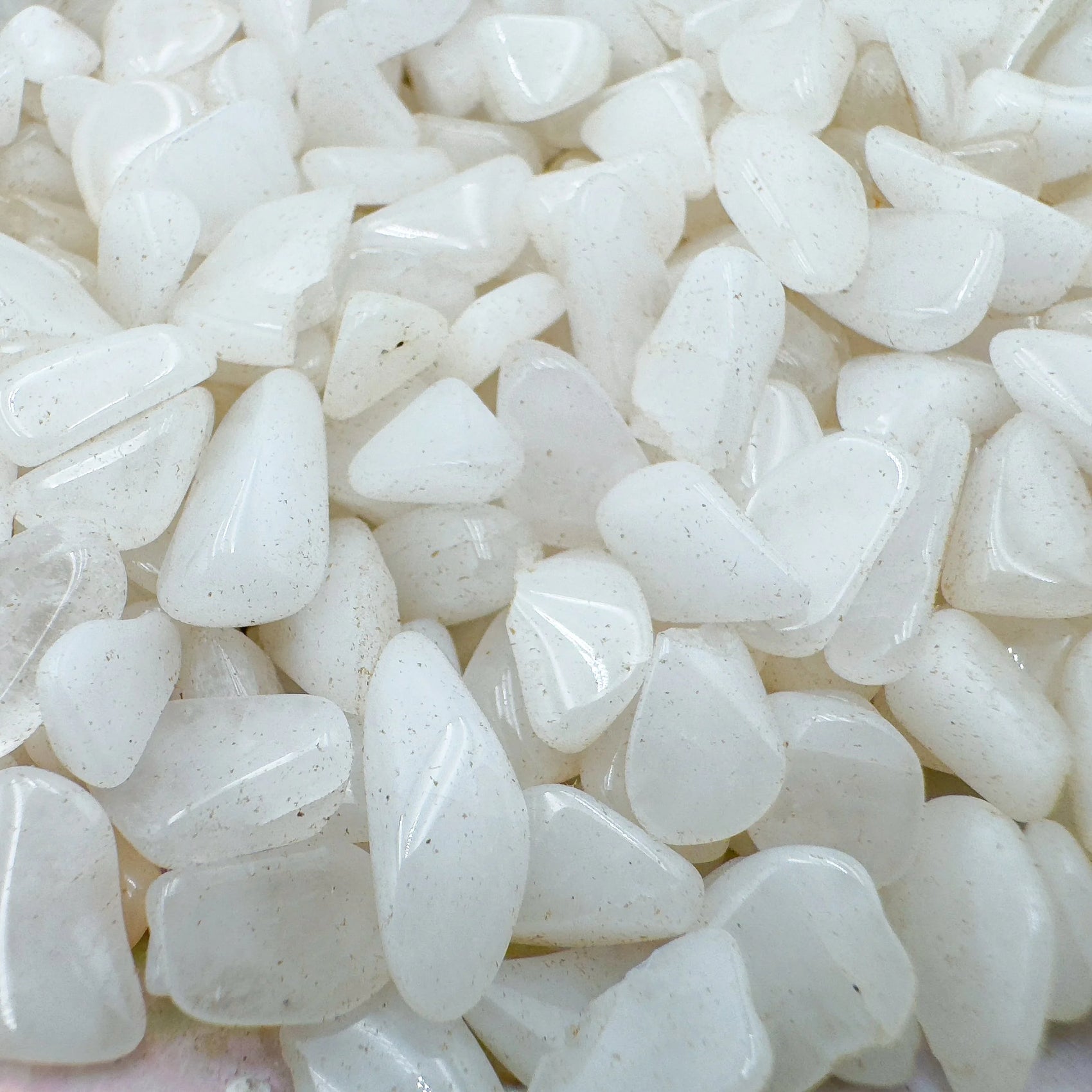 Close-up detail of Grade A Snow Quartz crystal chips showing natural white tones and texture