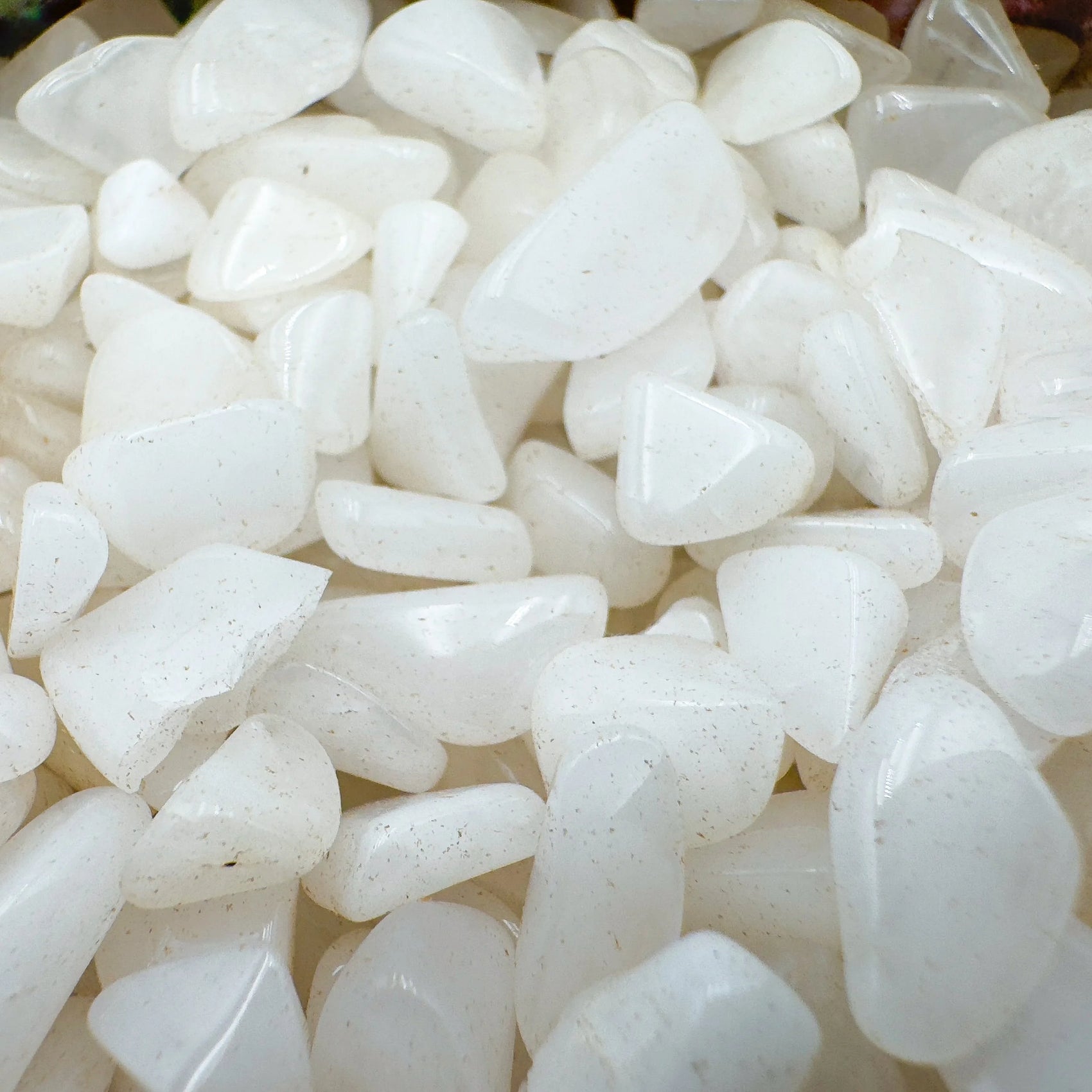 Side profile of Grade A Snow Quartz crystal chips with natural form and inclusions