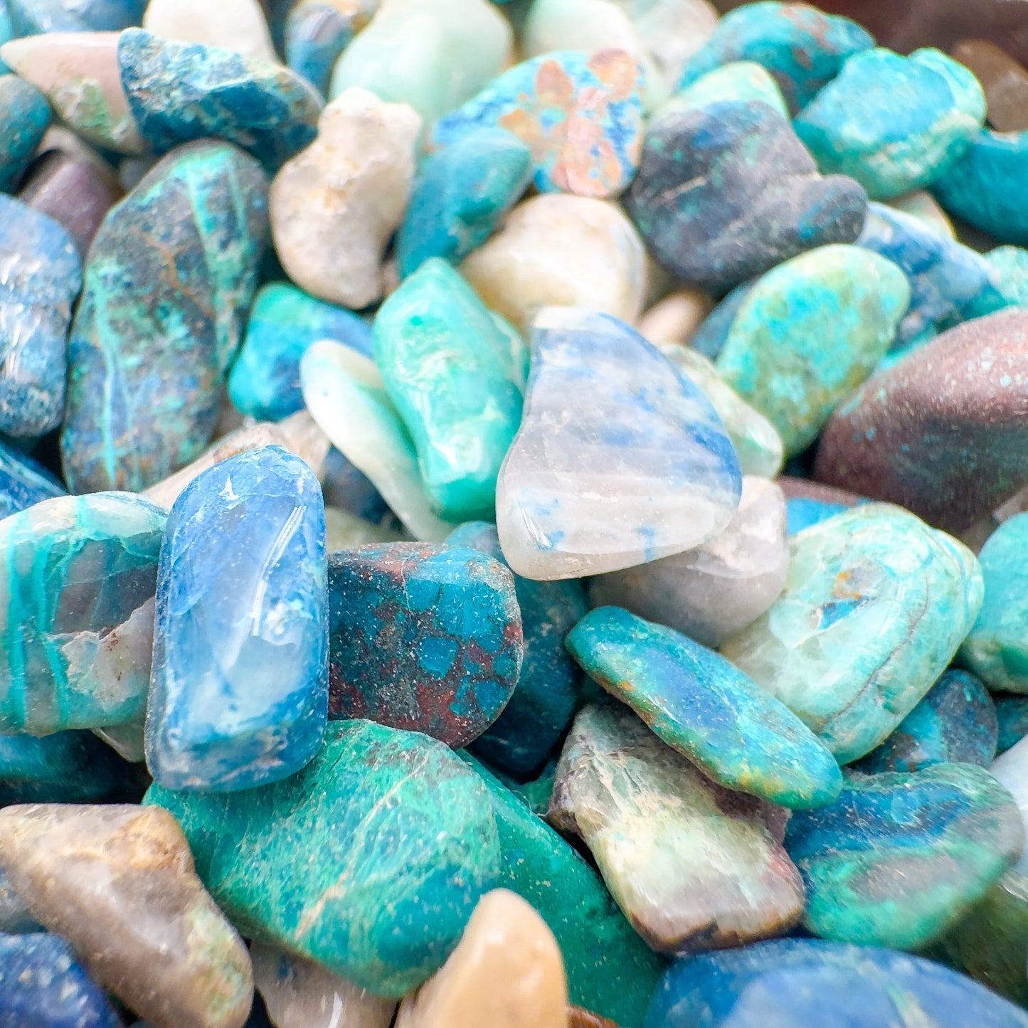 Edge-on view of Grade A Chrysocolla polished chip, showing earthy tone, sourced from Namibia.