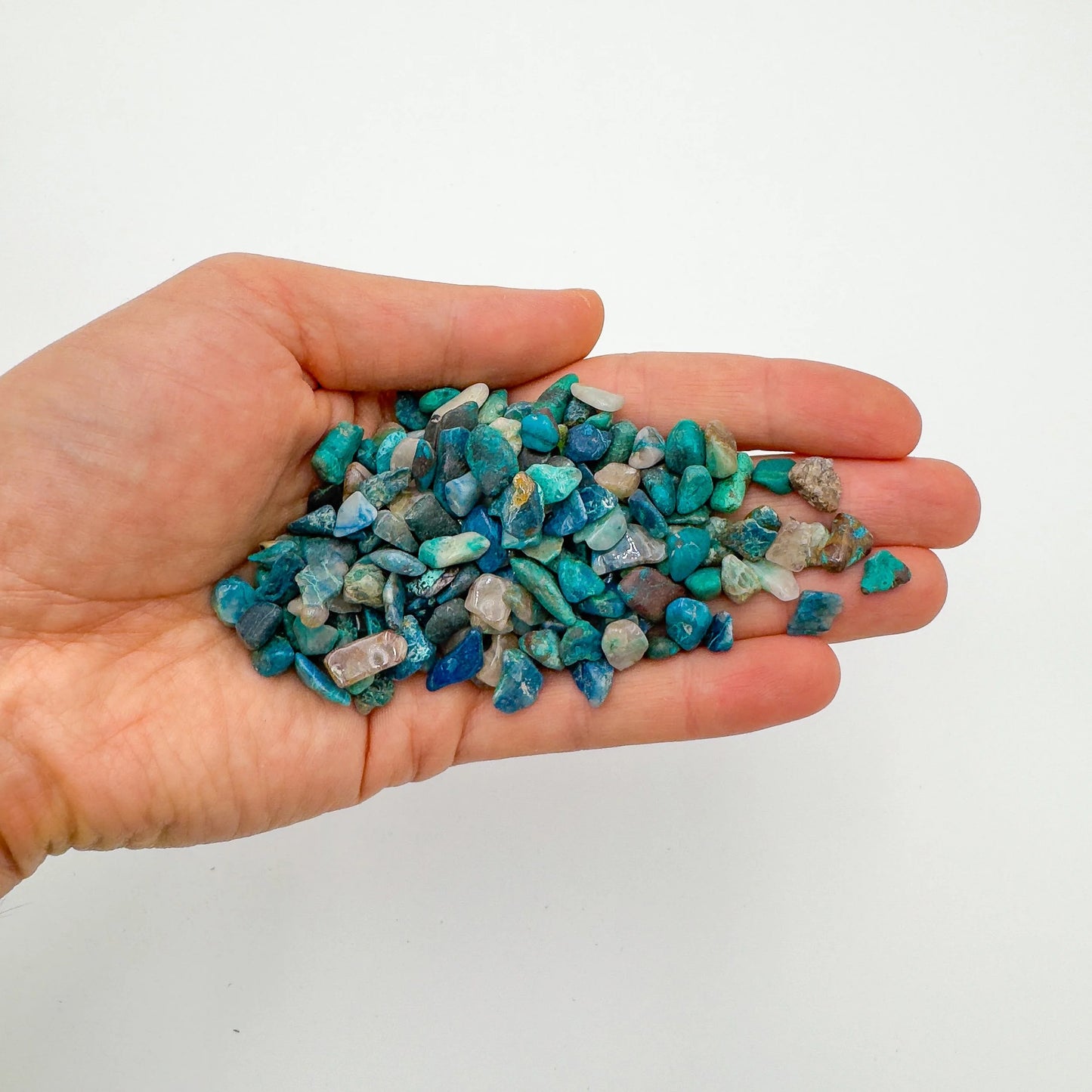 Bottom side of Grade A blue Chrysocolla polished chip, Namibia-sourced, showing natural texture.