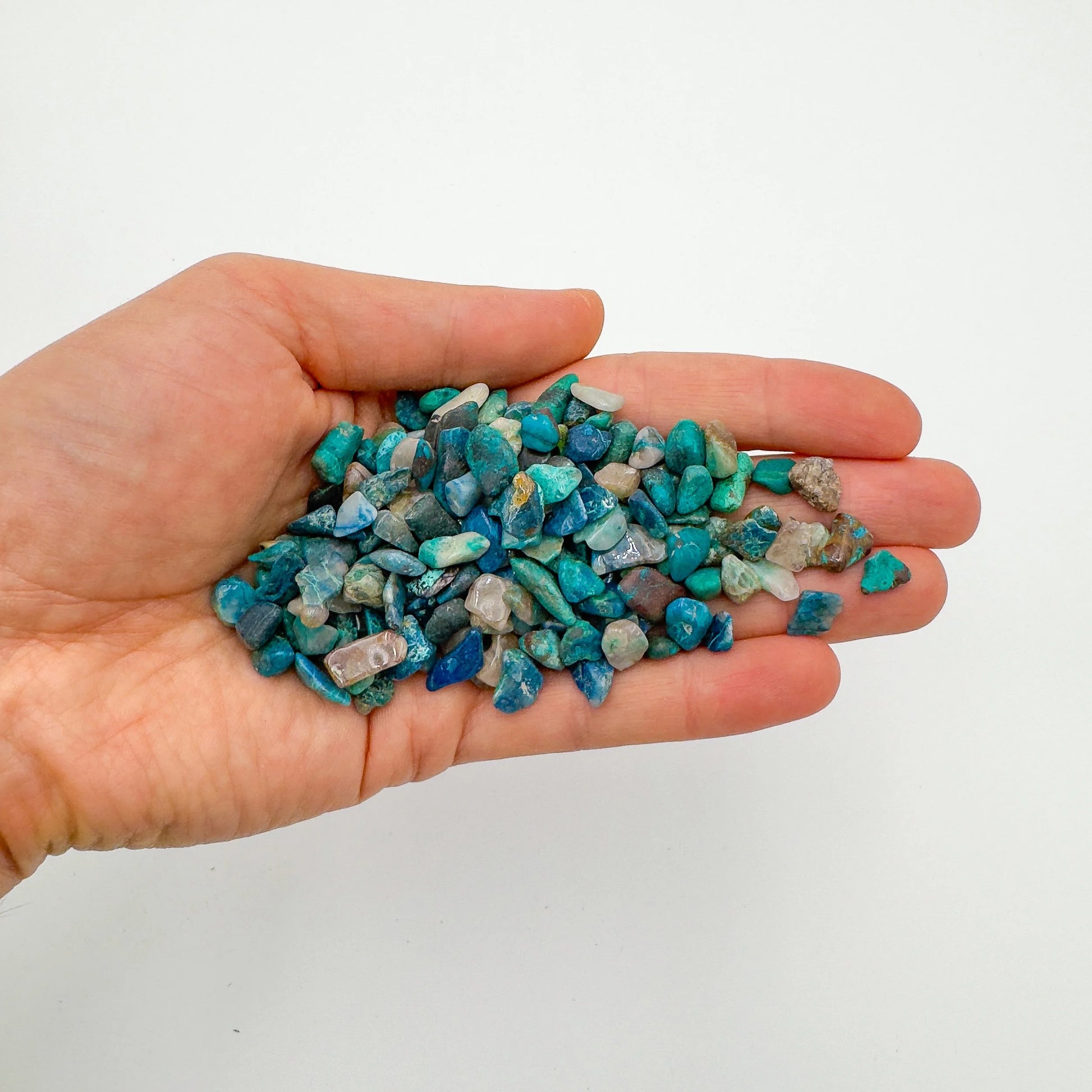 Bottom side of Grade A blue Chrysocolla polished chip, Namibia-sourced, showing natural texture.