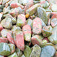 Macro view of Grade A green Unakite polished chip, sourced from Northern Cape, South Africa, showing characteristic finish.