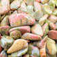 Side angle of Unakite polished chip, carried for Emotional Healing, showing natural inclusions.