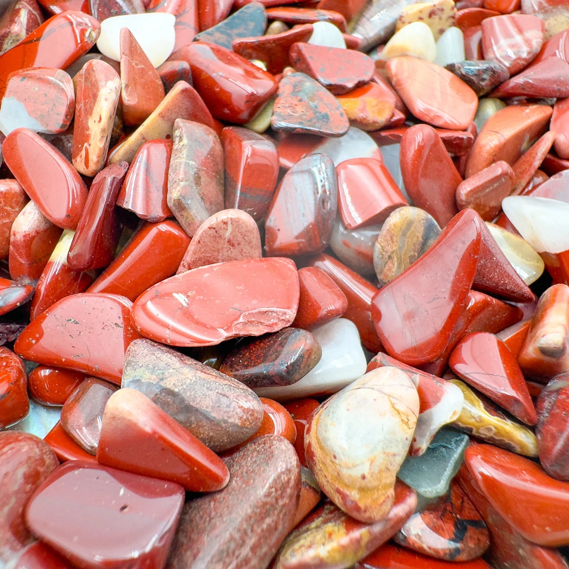 Detail of Grade A Red Jasper polished chip, showing translucent edges, from Northern Cape, South Africa.
