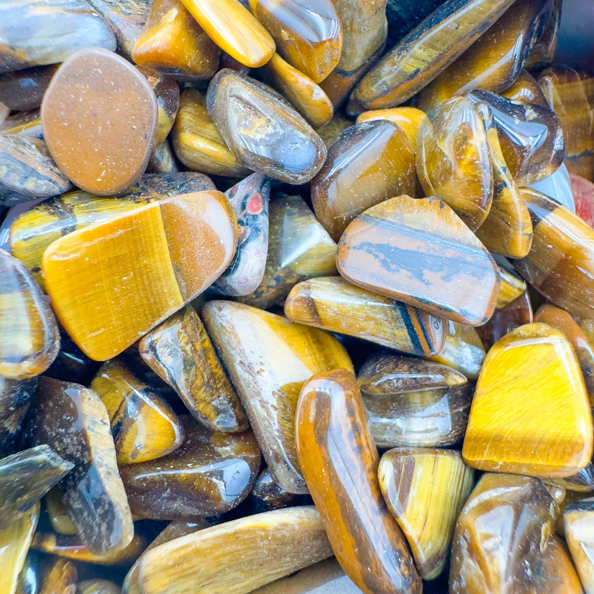 Overhead angle of Tiger Eye polished chip, sourced from Northern Cape, South Africa.