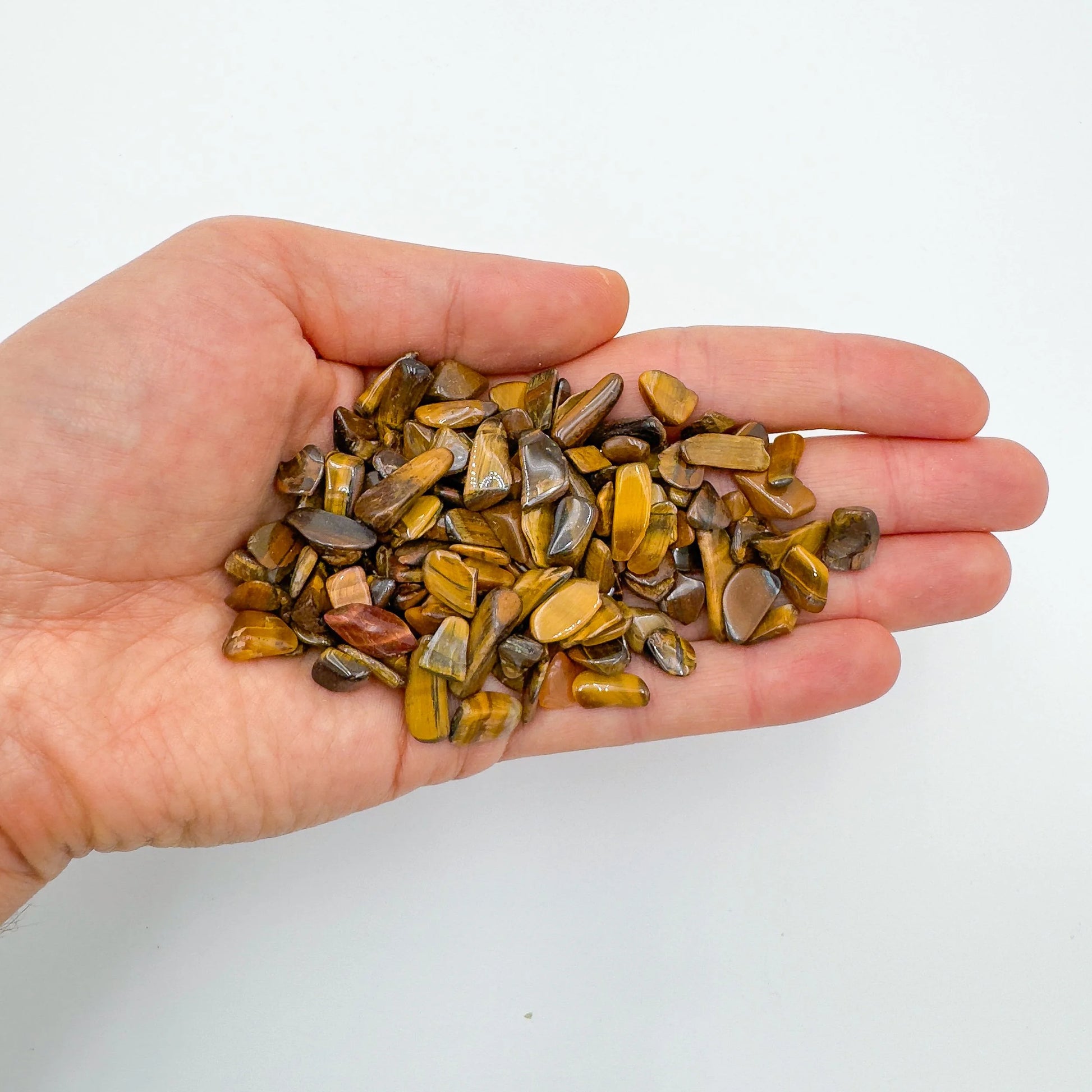 Opposite side of Tiger Eye polished chip, showing matte finish, often paired with practices around Confidence.