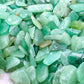 Detail capture of Aventurine polished chip, showing glassy finish, turned to for Luck.