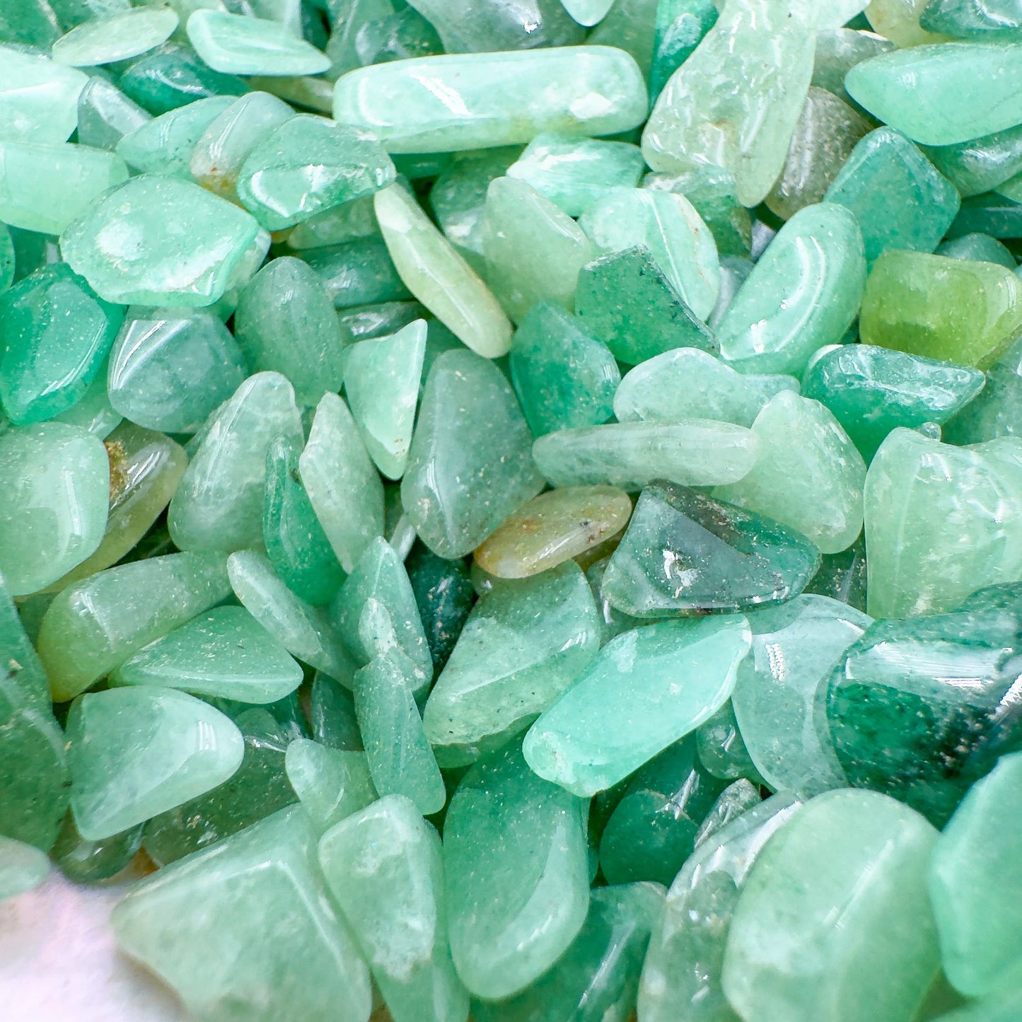 Detail capture of Aventurine polished chip, showing glassy finish, turned to for Luck.