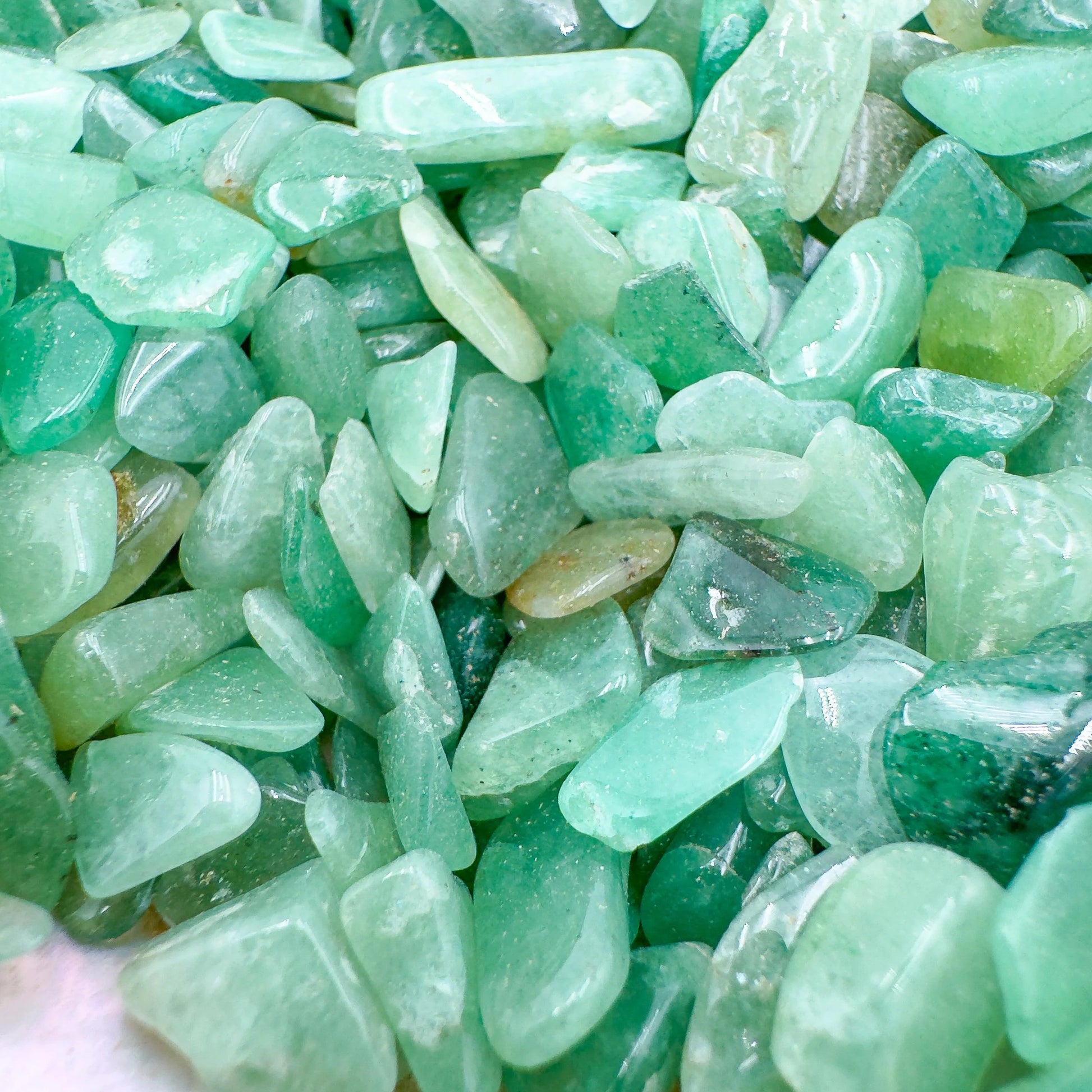 Detail capture of Aventurine polished chip, showing glassy finish, turned to for Luck.