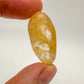 Back view of Grade AAA Golden Healer tumbled stone showing natural surface