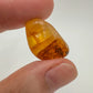Lifestyle view of a Golden Healer tumbled stone linked to Healing and Meditation, sourced from Minas Gerais, Brazil.