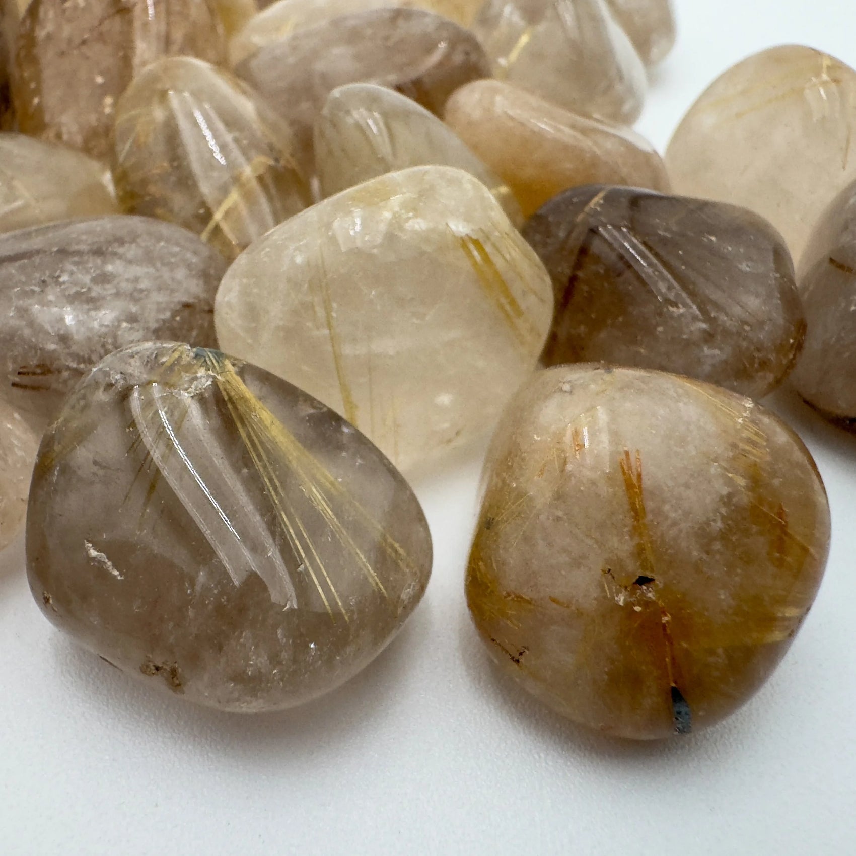Profile shot of clear Quartz tumbled stone, to support Cleansing and Meditation, Brazil-sourced.