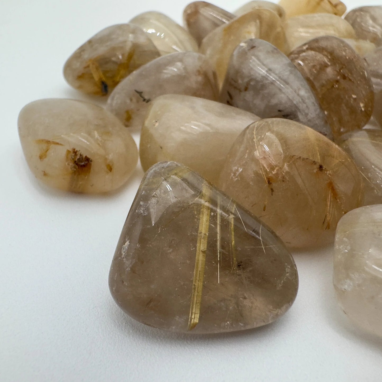 Texture-level view of Grade AA Quartz tumbled stone, Brazil-sourced.