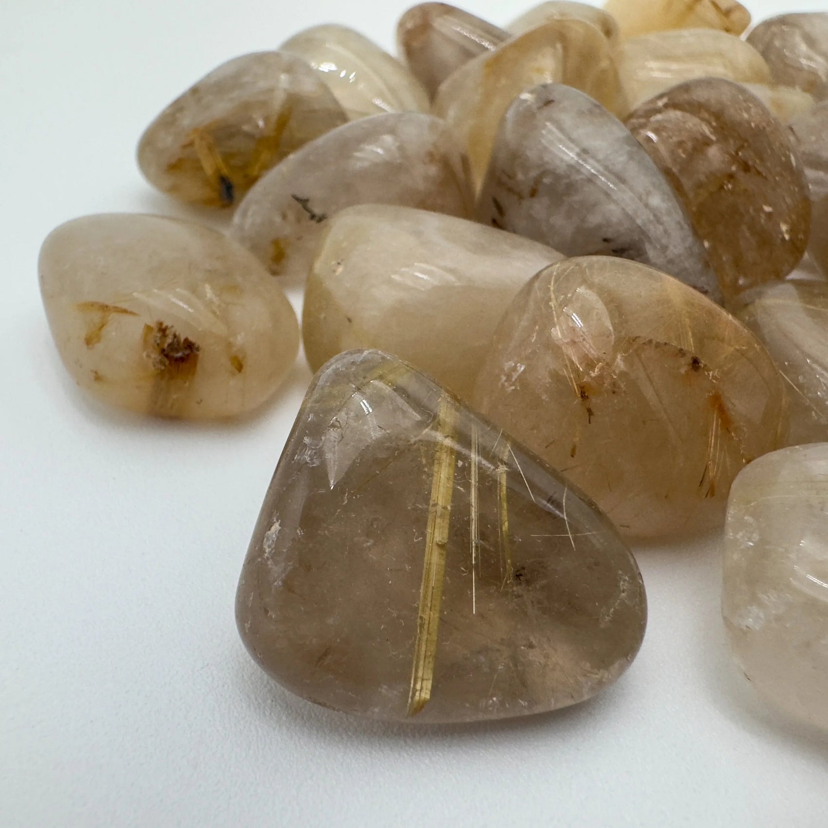 Texture-level view of Grade AA Quartz tumbled stone, Brazil-sourced.