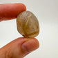 Bottom side of Quartz tumbled stone, often worked with for Cleansing and Meditation.