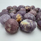 Natural surface of Lepidolite tumbled stone, showing natural texture, kept close for Stress Relief and Emotional Healing.