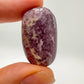 Companion image of Lepidolite tumbled stone, from Arequipa, Peru, with form visible in context.