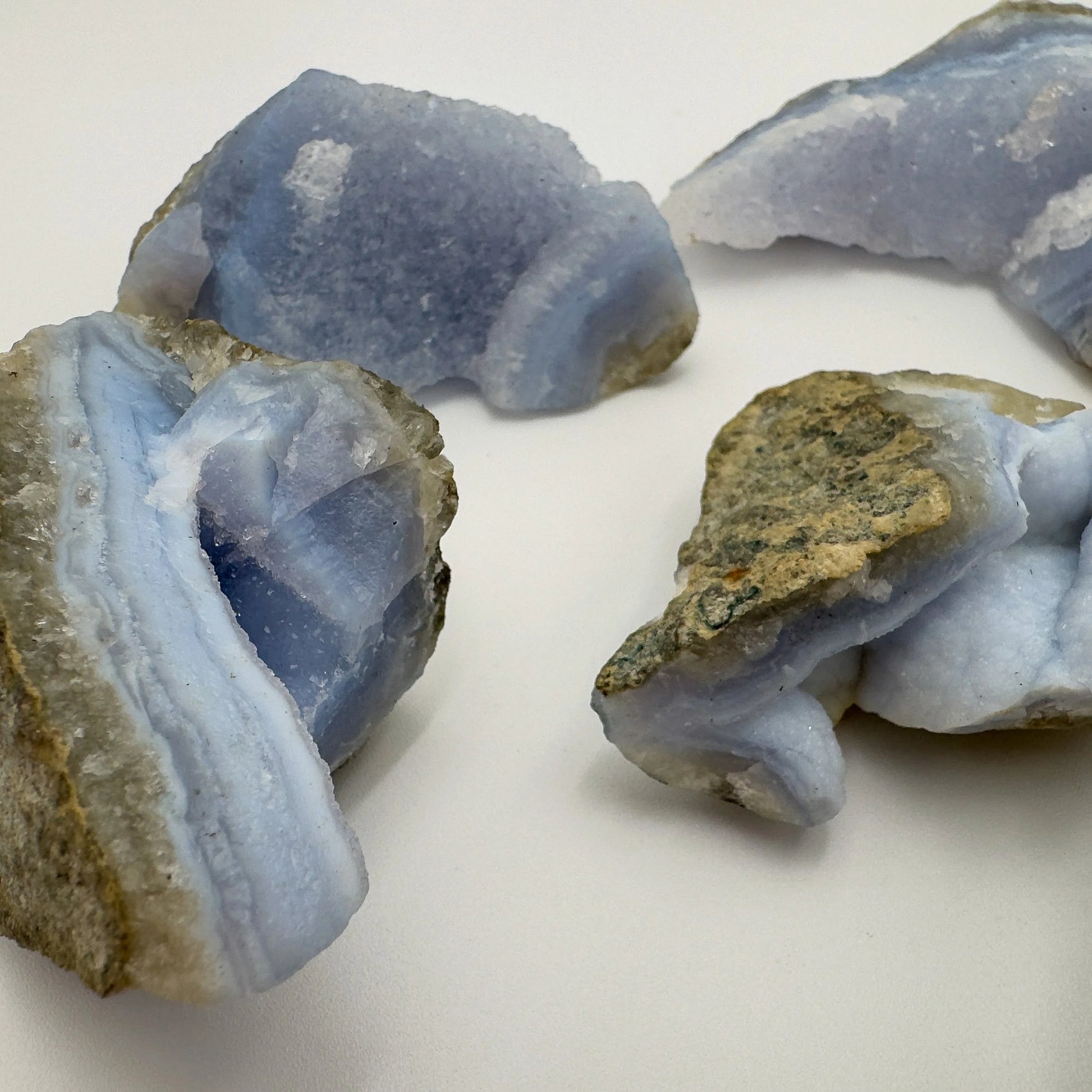 Grade aa blue lace agate geode held in hand for size reference