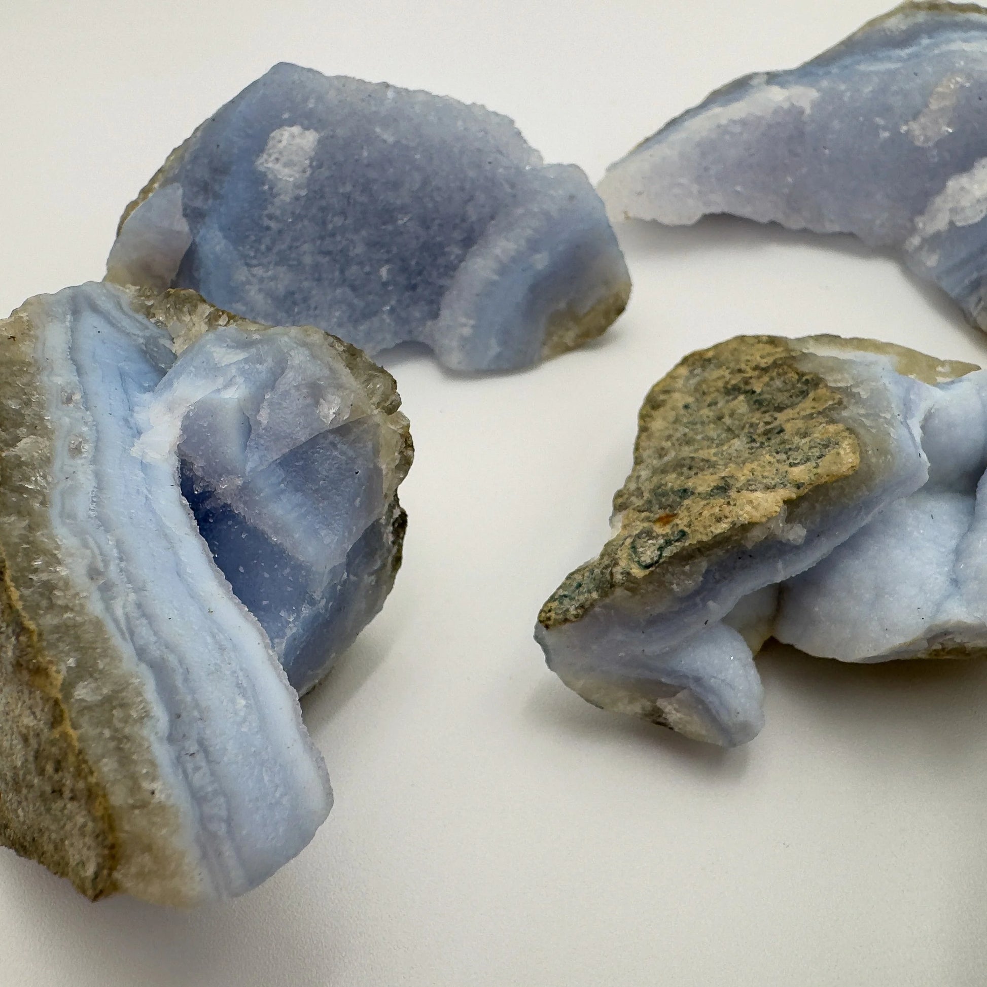 Grade aa blue lace agate geode held in hand for size reference