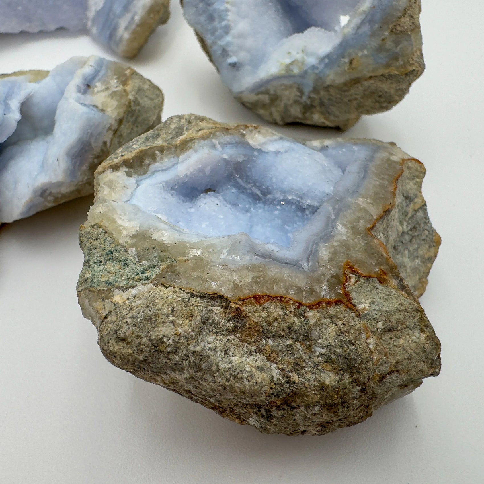Overhead view of Blue Lace Agate raw geode, showing natural sheen.