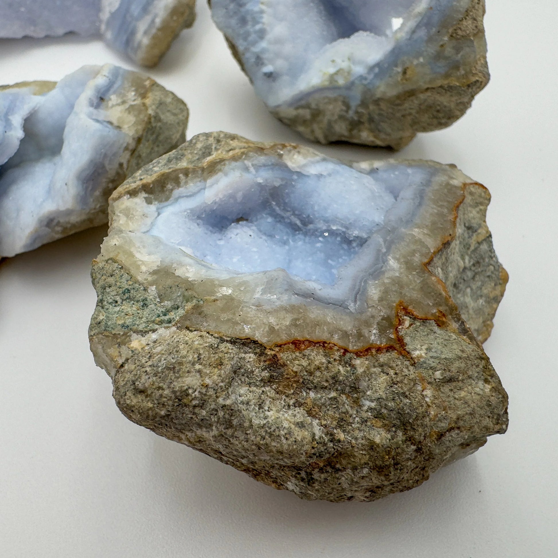 Overhead view of Blue Lace Agate raw geode, showing natural sheen.
