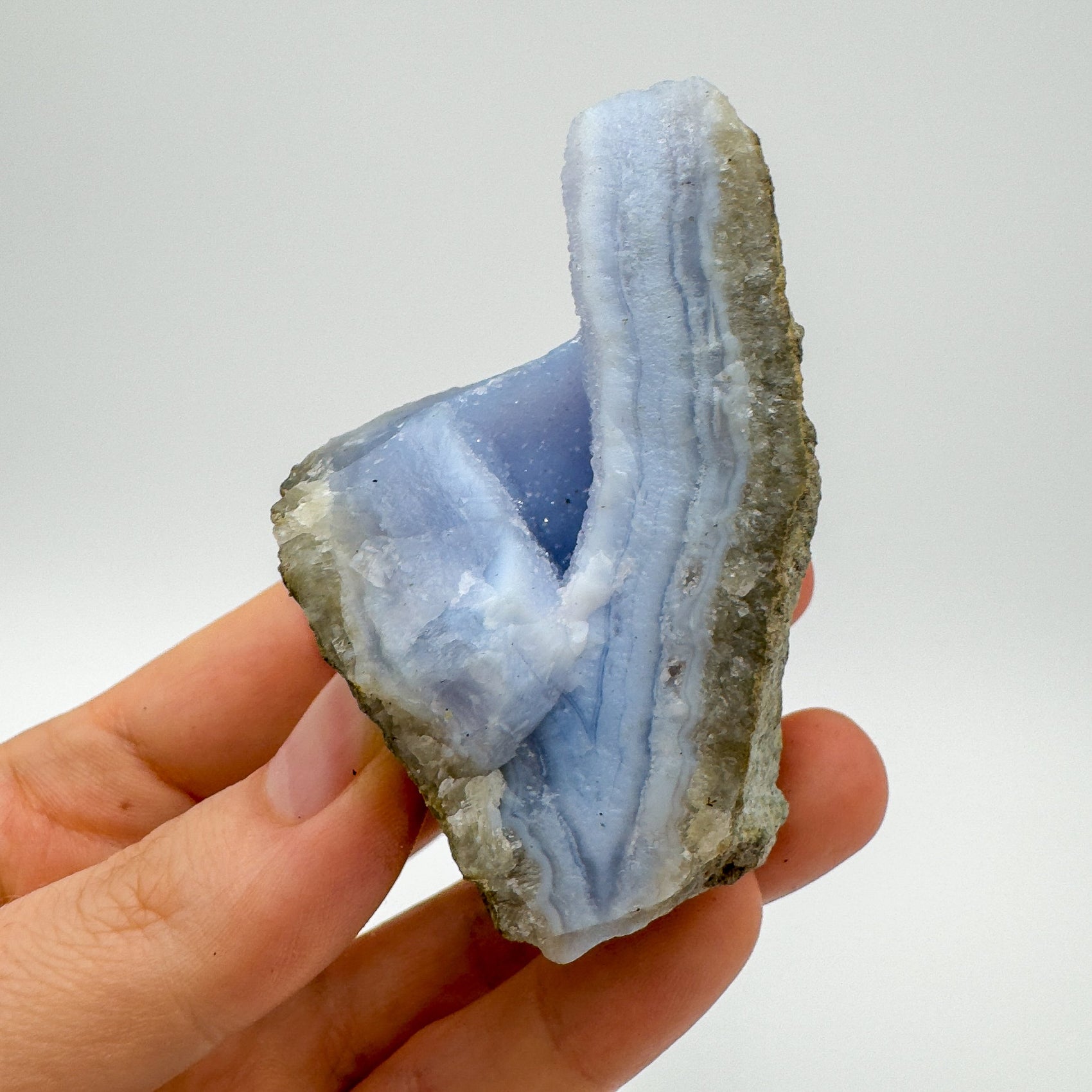 Back view of Grade AA Blue Lace Agate geode showing natural surface