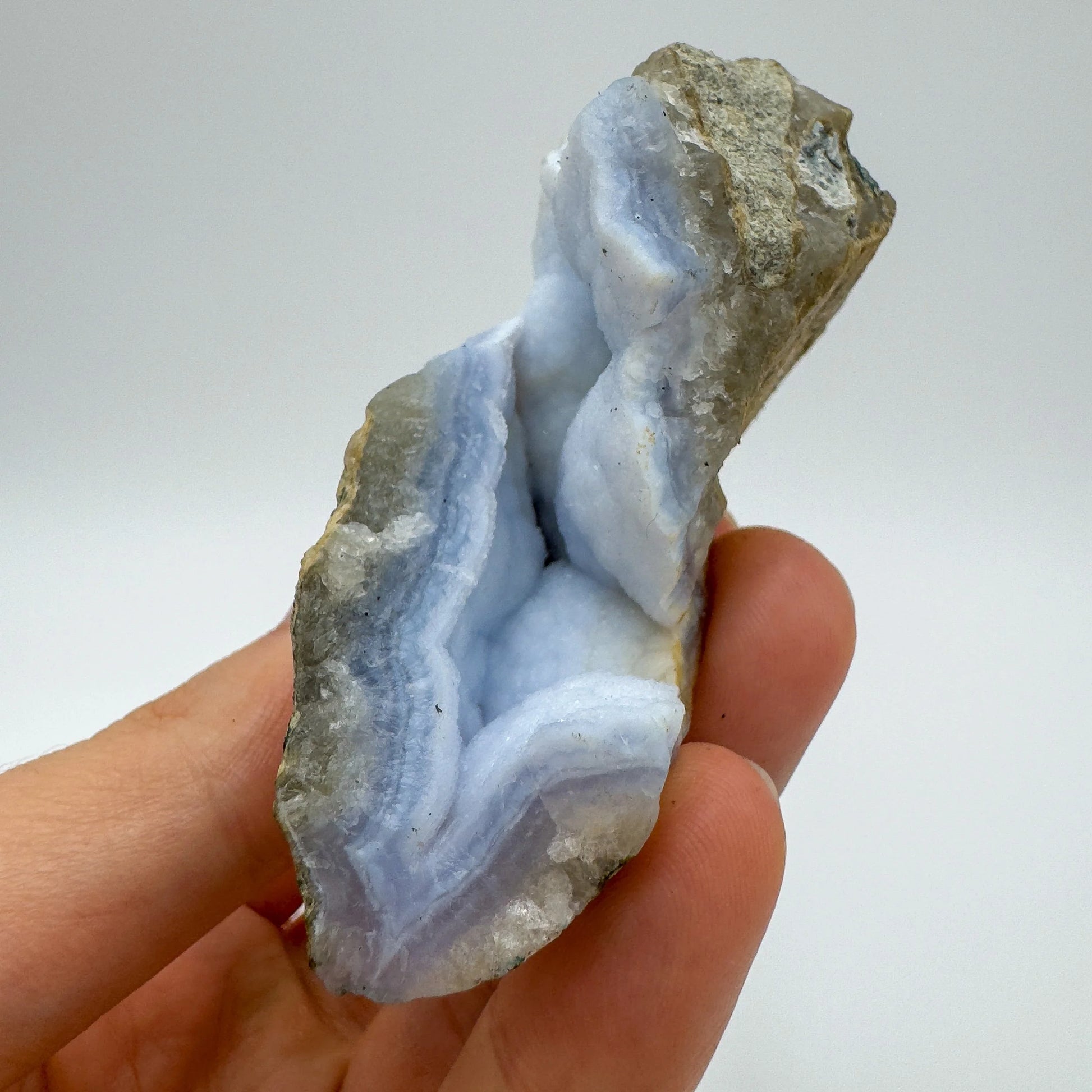 Detail shot of Grade AA Blue Lace Agate geode under natural light