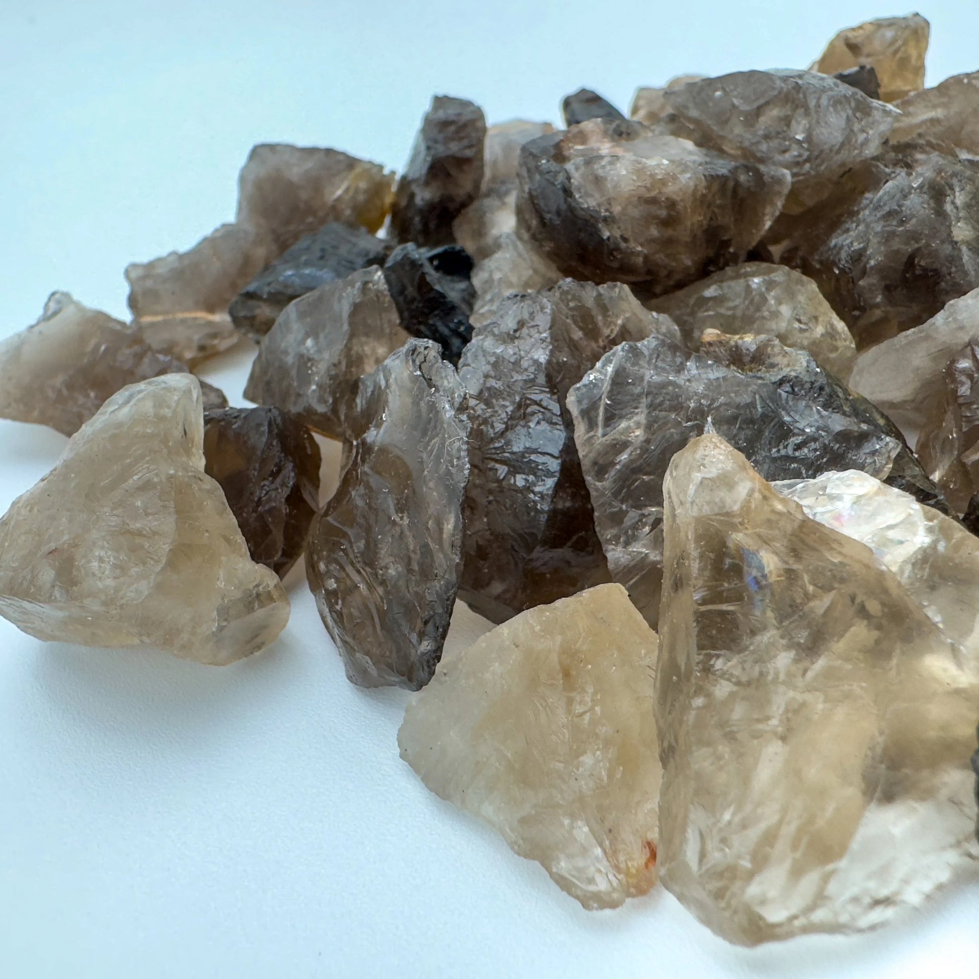 Side profile of Grade AA Smoky Quartz raw with natural form and inclusions