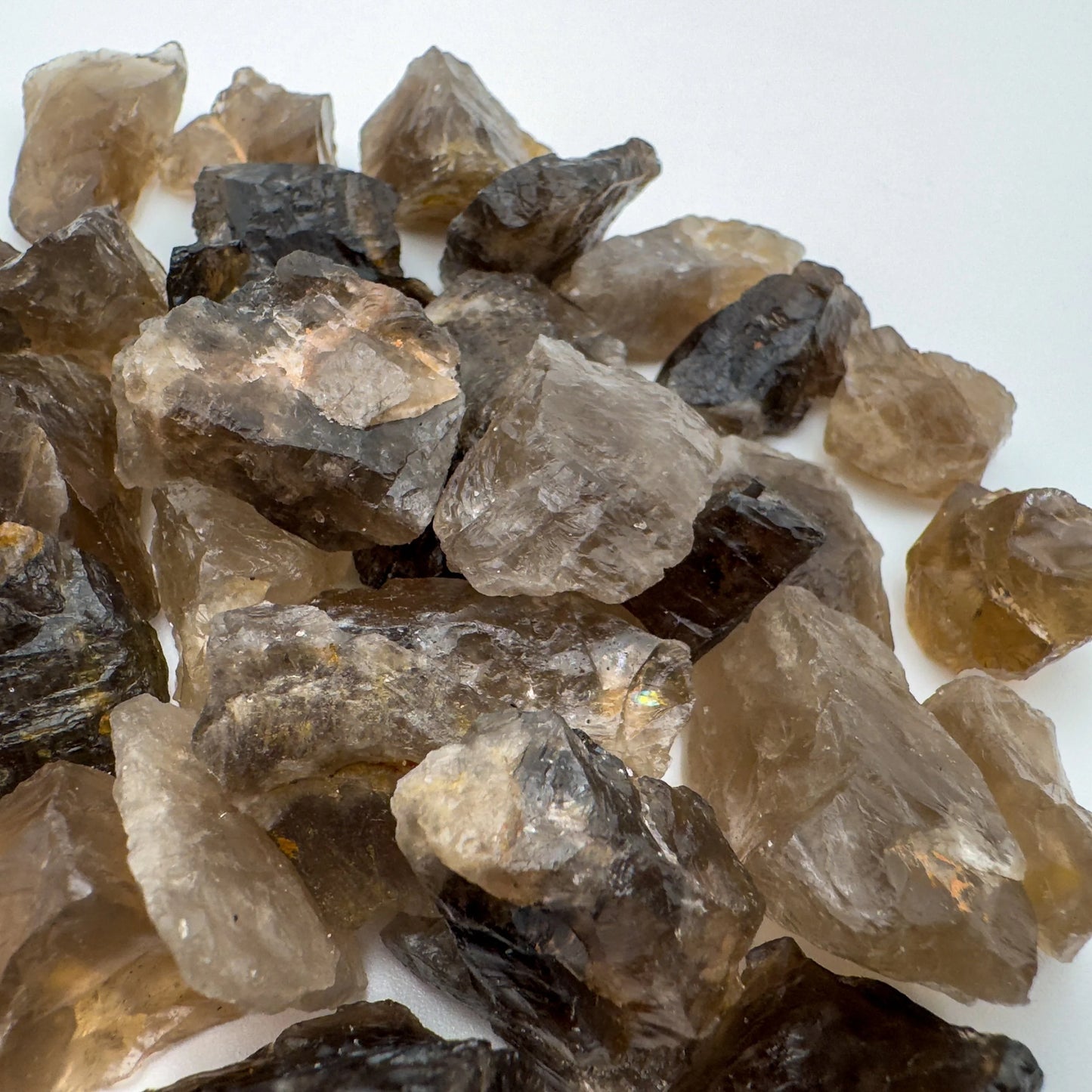 Grade aa smoky quartz raw held in hand for size reference
