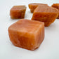 Top-side view of Orange Calcite raw stone, from Namibia, showing natural color depth.