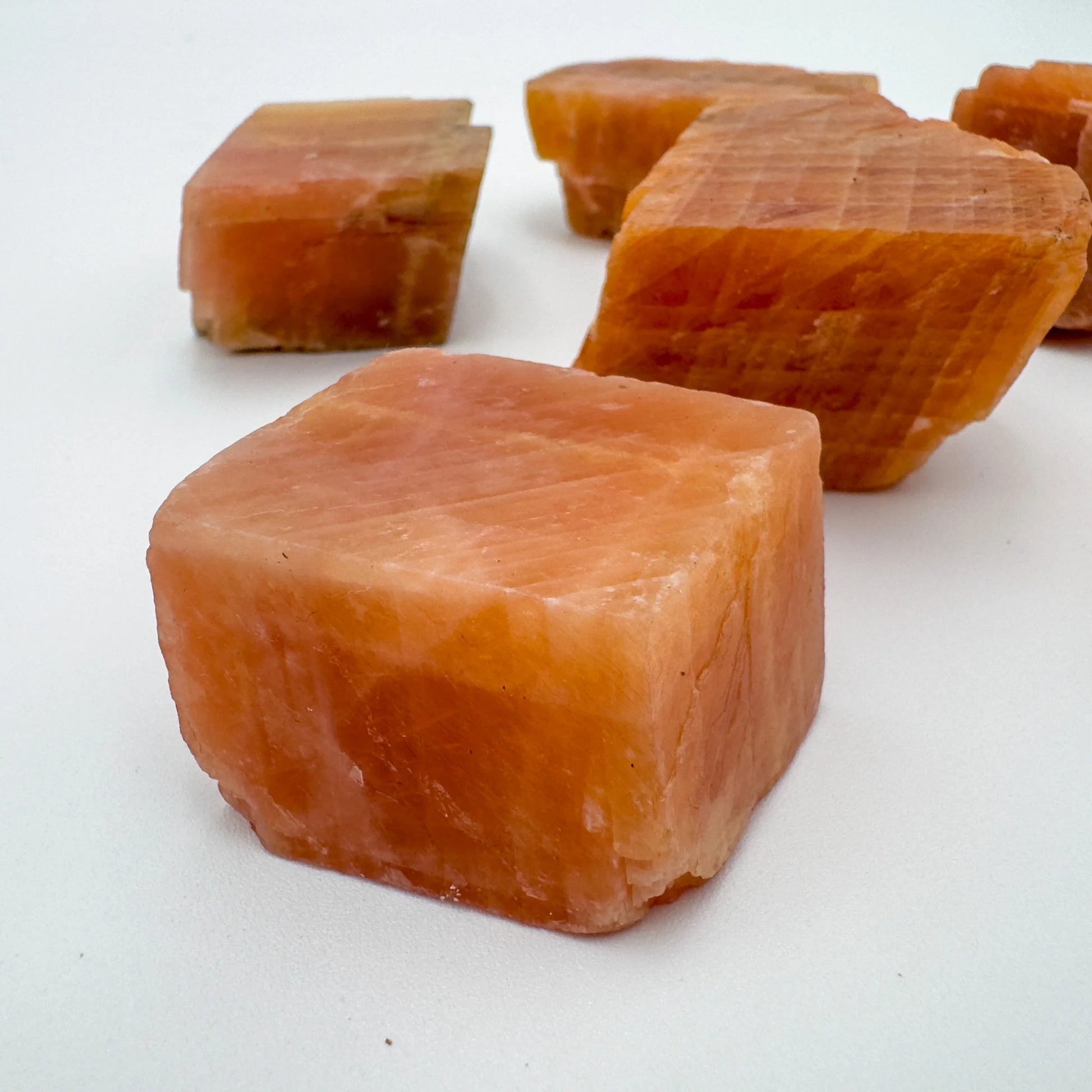 Top-side view of Orange Calcite raw stone, from Namibia, showing natural color depth.