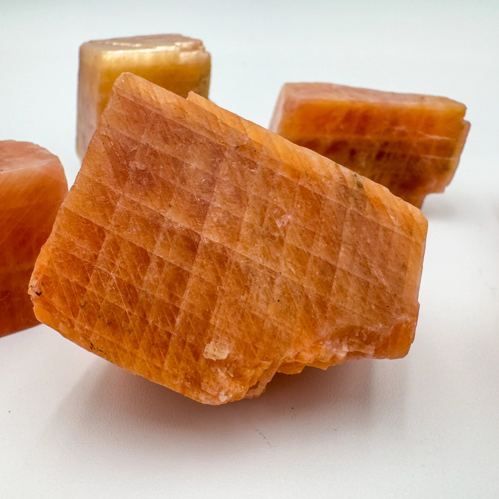 Alternate angle of Grade AA Orange Calcite raw stone, associated with Energy and Creativity.