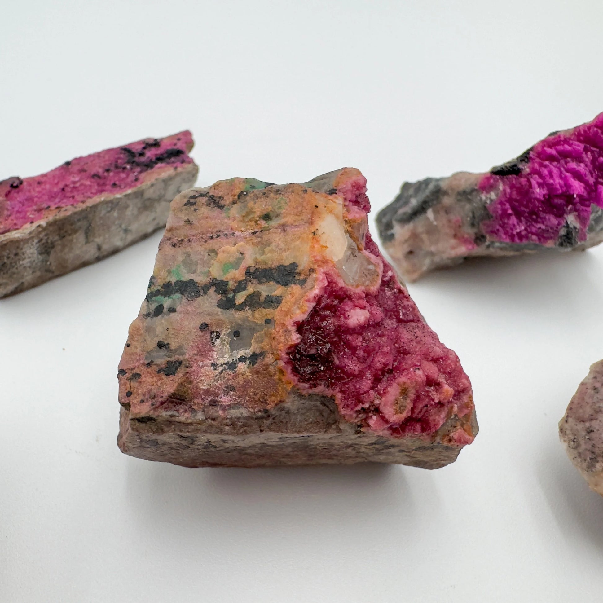 Top angle of Grade AA Cobalt Calcite raw stone, to support Love, showing natural form.