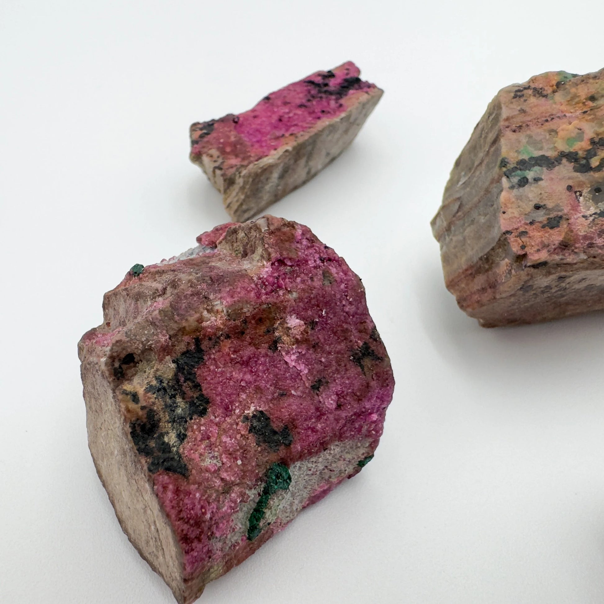 Opposite side of Grade AA Cobalt Calcite raw stone, sourced from Haut-Lomami, Democratic Republic of the Congo, showing open form.
