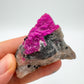 In context of a Cobalt Calcite raw crystal, with surface texture in view.