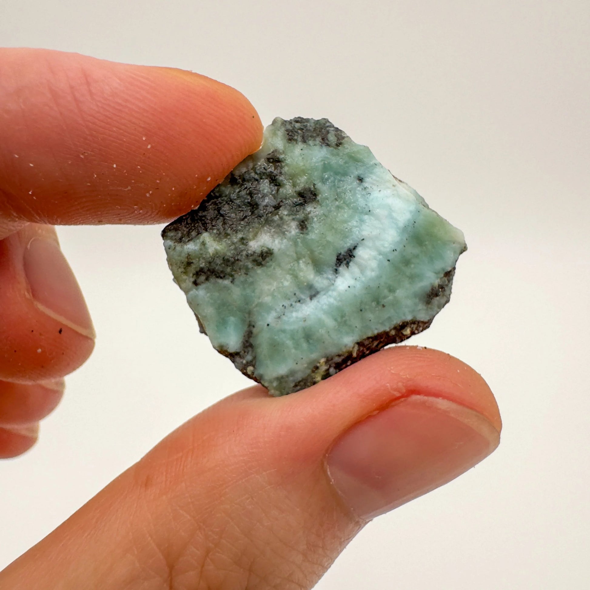 Close-up of Larimar raw stone from Dominican Republic, soothing wellness stone for Emotional Healing