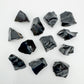 Close detail of Black Obsidian raw stone, showing natural texture.